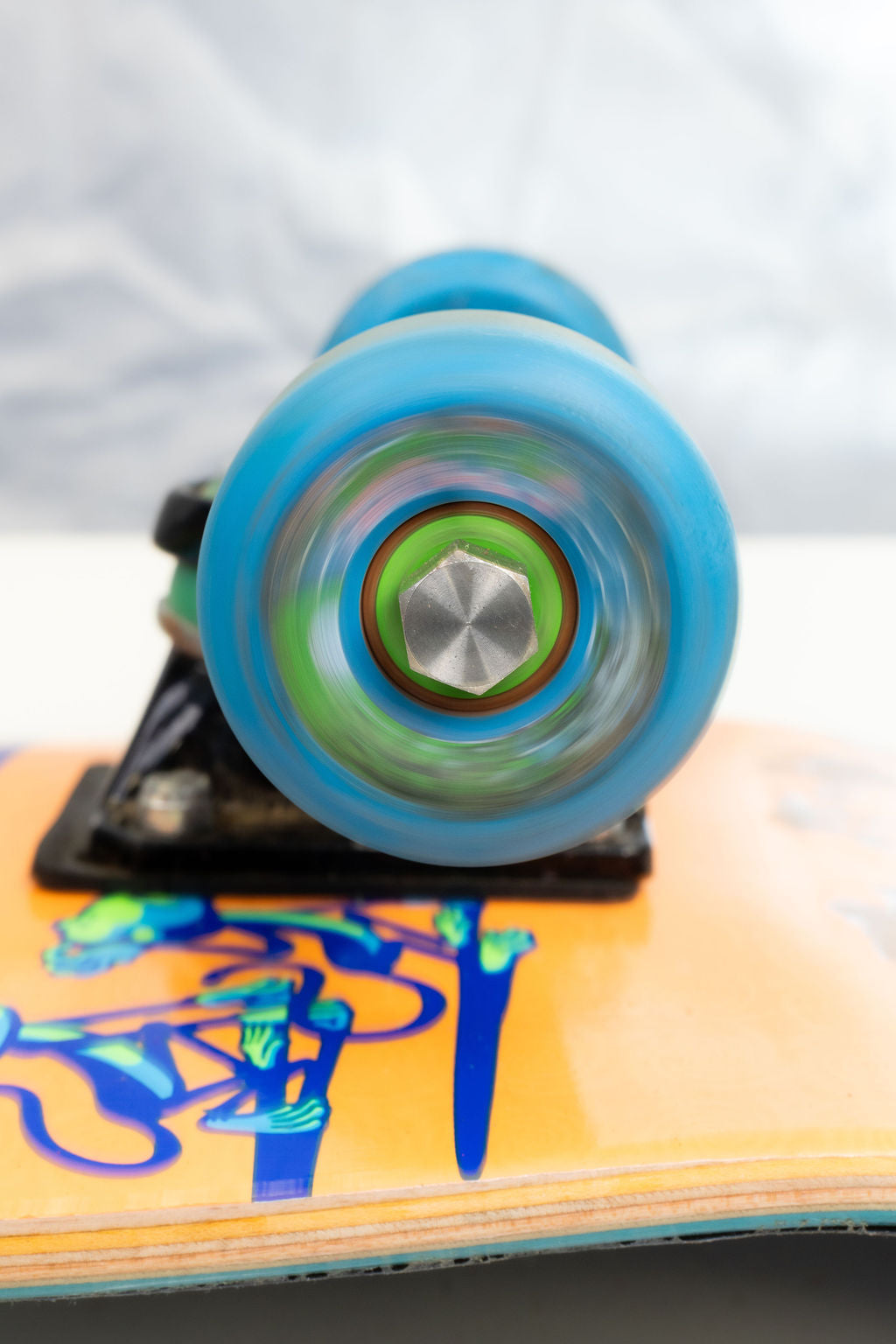Dognut installed on a blue skateboard wheel, viewed from the axle side.