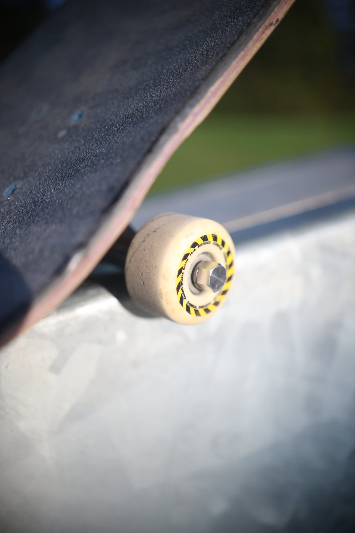 Angled view of a Dognut installed on a skateboard wheel axle
